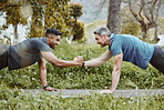 Fitness, nature and men doing push up in team for arm strength or muscle development in park. Sports, workout and male athlete friends doing cardio exercise for training together in outdoor garden.