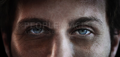 Buy stock photo Eyes, vision and a man closeup in studio on a dark background for mental health or depression. PTSD, trauma or awareness and pupil portrait of a person looking serious about a memory and idea