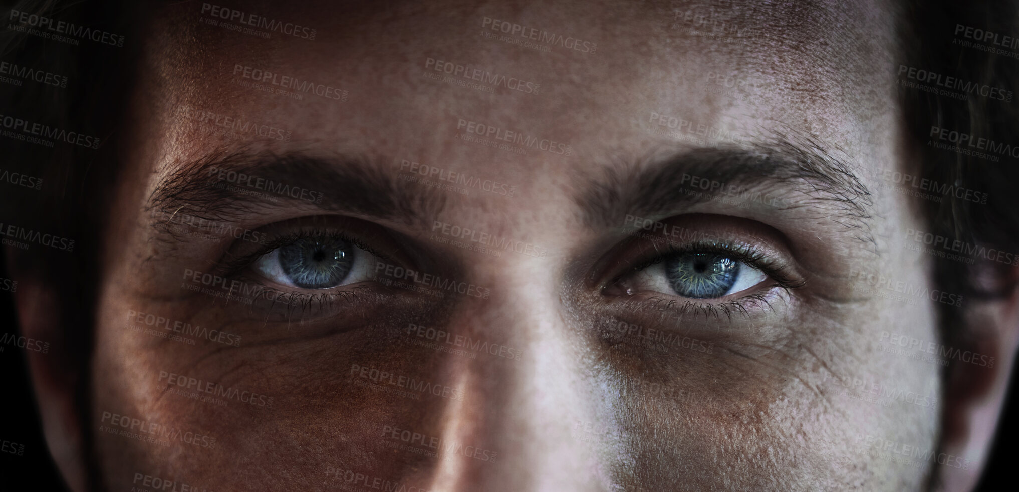 Buy stock photo Eyes, vision and a man closeup in studio on a dark background for mental health or depression. PTSD, trauma or awareness and pupil portrait of a person looking serious about a memory and idea