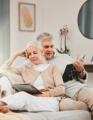 Buy stock photo Old couple, reading book and couch in home for learning relax or retirement, storytelling or happiness. Elderly people, sofa or lounge for connection or information, knowledge or bonding in apartment