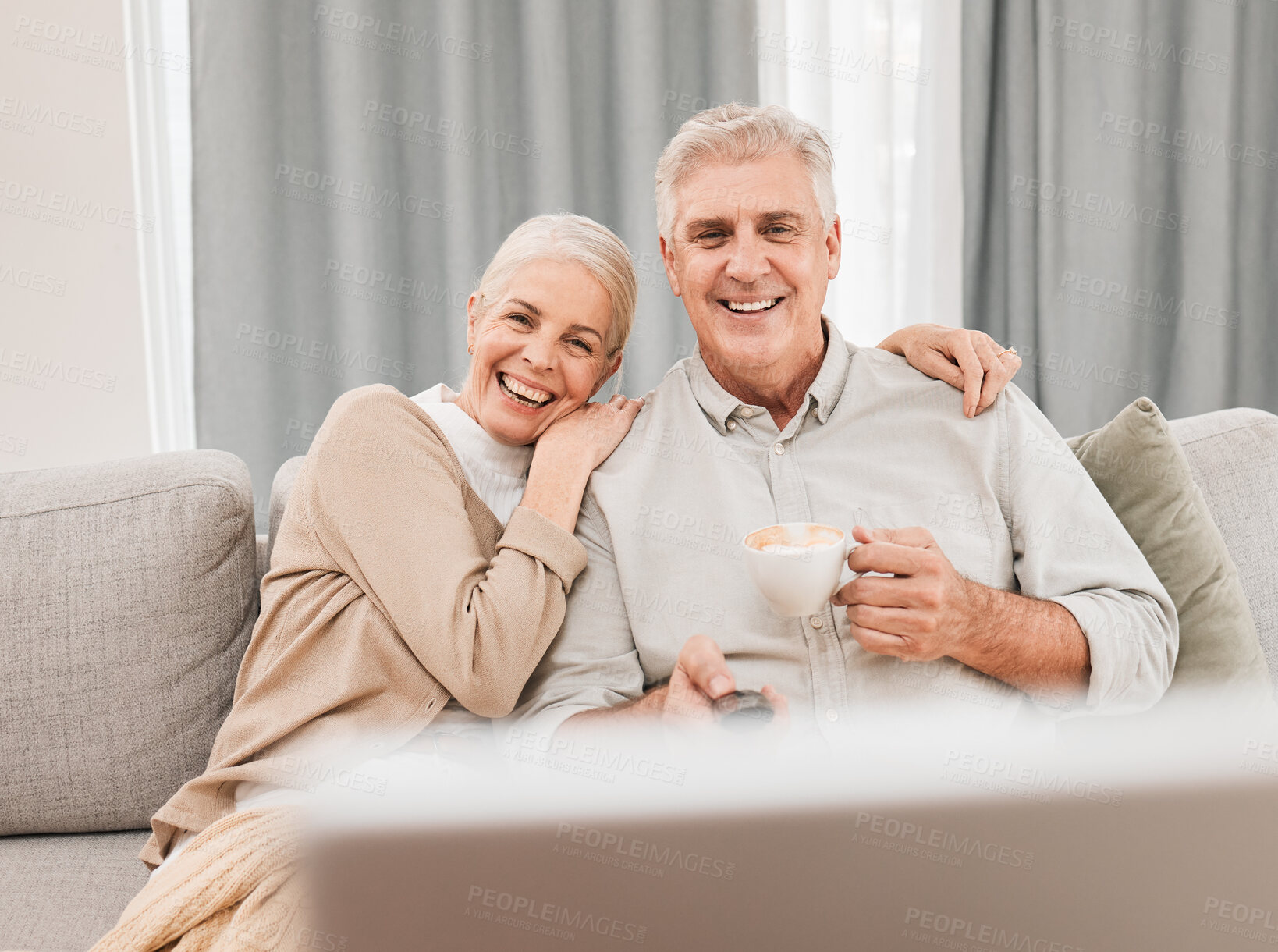 Buy stock photo Old people, home and watching tv with coffee and happiness together in retirement with comedy and partner. Love, care and online streaming, funny tv show with tea and couple relax on couch for movie