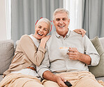 Senior couple, watching tv and laughing on a living room sofa with tea and movie at home. Elderly people, bonding and marriage in retirement with series and streaming in a lounge on a couch together