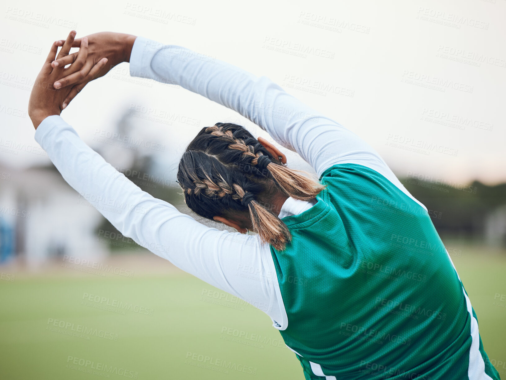 Buy stock photo Back, stretching and a woman hockey player at the start of a game or competition outdoor for fitness. Sports, exercise and warm up with an athlete getting ready for a training workout on a field