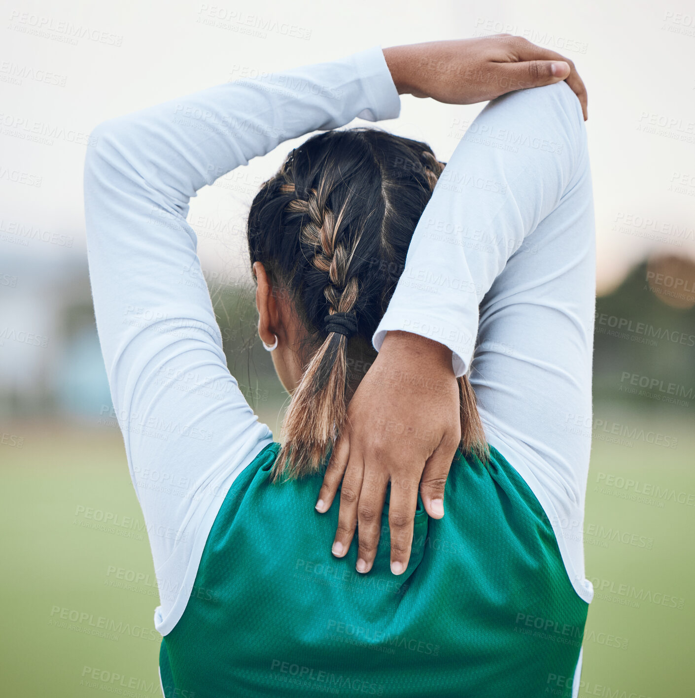 Buy stock photo Back, stretching and a woman hockey player getting ready for the start of a game or competition outdoor. Sports, fitness and warm up with an athlete on a field for a training workout or practice