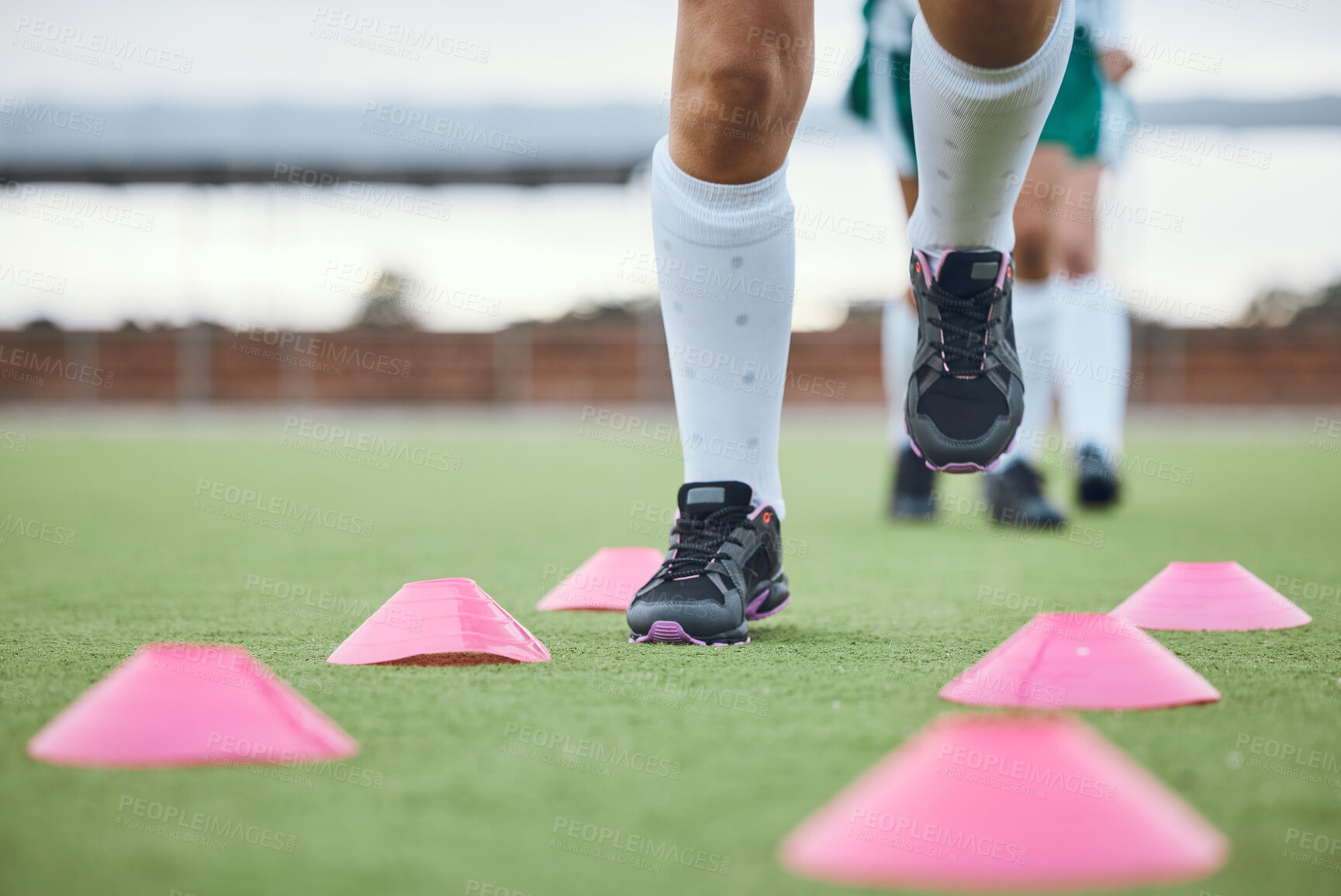 Buy stock photo Cone, legs or athlete running for speed training, workout and warm up exercise on a outdoor hockey turf. Footwear closeup, healthy or sports person on grass playing in a practice game for fitness