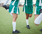 Team, stretching legs and fitness on field, sports and uniform for match, balance and teamwork together. Diverse group of athletes, outdoor and exercise to prepare for game, workout for performance