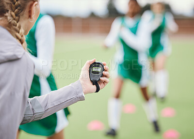 Buy stock photo Coach, timer and team in training, field and sports in blurred background. Trainer, stopwatch and teaching for progress, fitness and performance by digital, athlete and exercise in diversity on clock