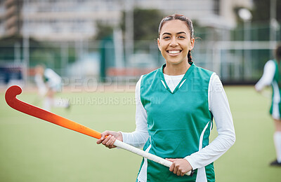 Buy stock photo Female, person and happy for hockey with stick in hand on field for training in portrait. Girl, hold and smile with confidence for sports with pose, stand and equipment for match, game or fitness