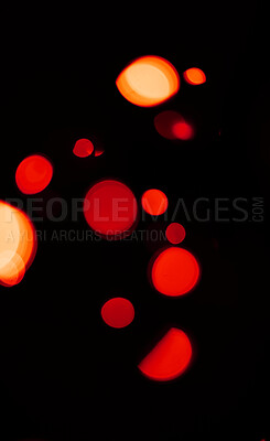 Bokeh, red and orange lights on dark wallpaper with pattern, texture and mockup with cosmic aesthetic. Night lighting, sparkle particles and glow on black background with space, color shine and flare