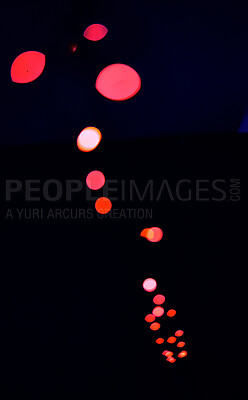 Bokeh, red lamp lights on black background with pattern, texture and dots mockup with cosmic aesthetic. Night lighting, sparkle particles and glow on dark wallpaper with space, color shine and flare.