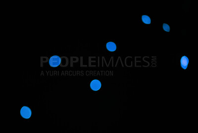 Bokeh, blue dots and lights on black background with pattern, texture and mockup with cosmic aesthetic. Night lighting, sparkle particles and glow on dark wallpaper with space, color shine and flare.