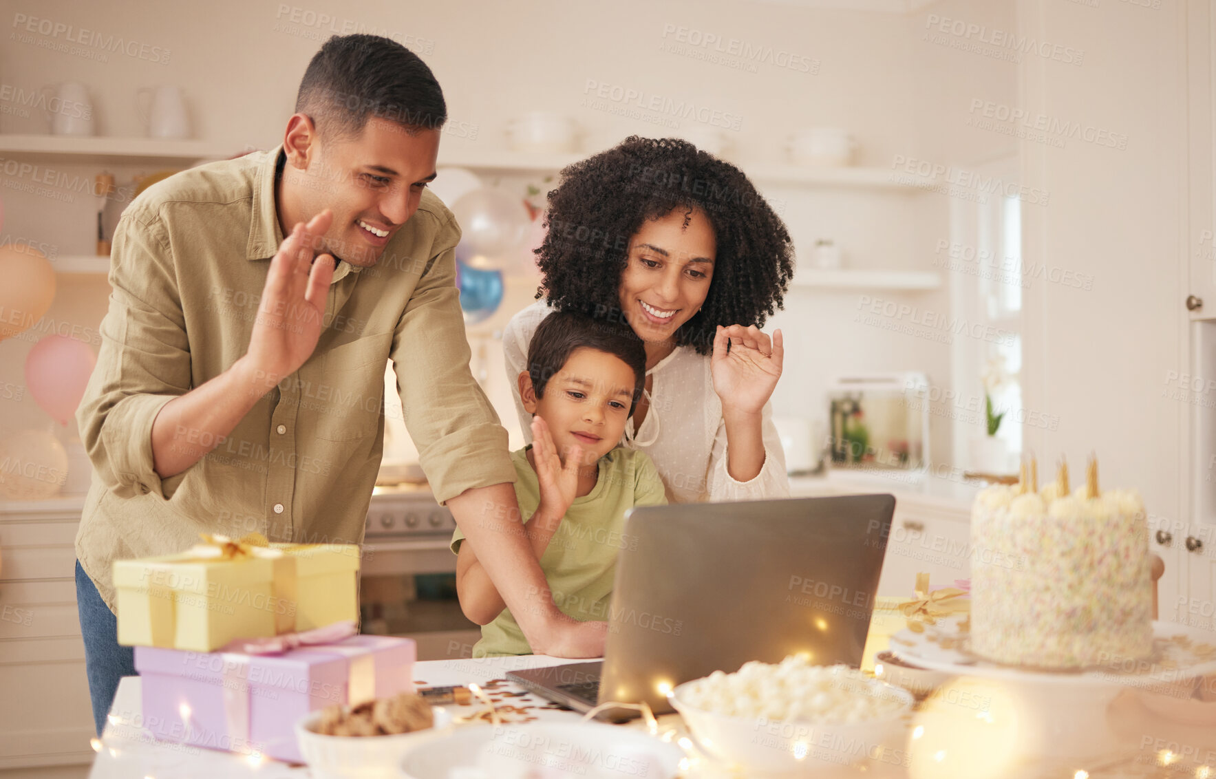 Laptop, video call and family with birthday celebration in a kitchen happy,  excited and love in their home. Virtual, party and hello by parents with  child online with cake, gift or waving