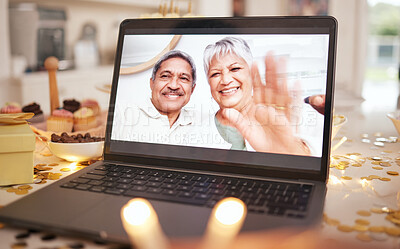 Buy stock photo Senior couple, laptop screen and video call on table at party, event or dinner by candle, glitter or wave. Elderly man, woman and hello with smile, contact or webinar for chat for happy birthday wish