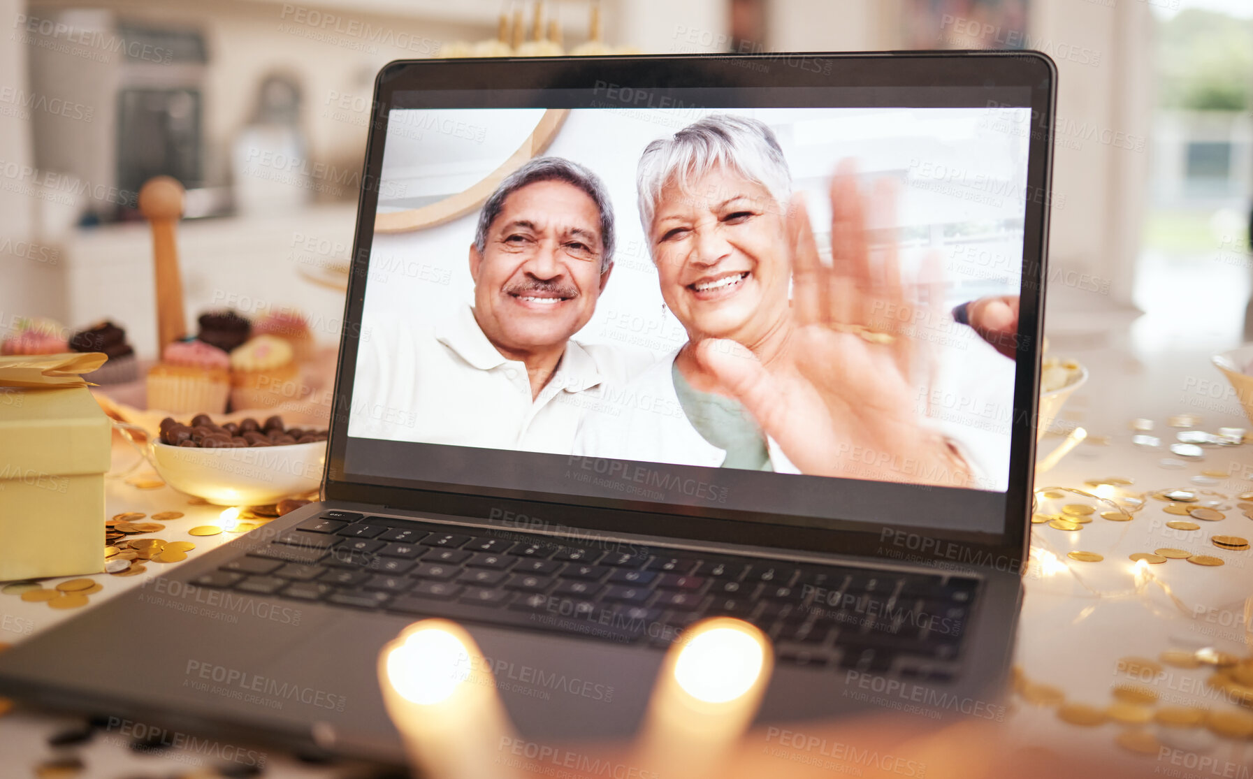 Buy stock photo Senior couple, laptop screen and video call on table at party, event or dinner by candle, glitter or wave. Elderly man, woman and hello with smile, contact or webinar for chat for happy birthday wish