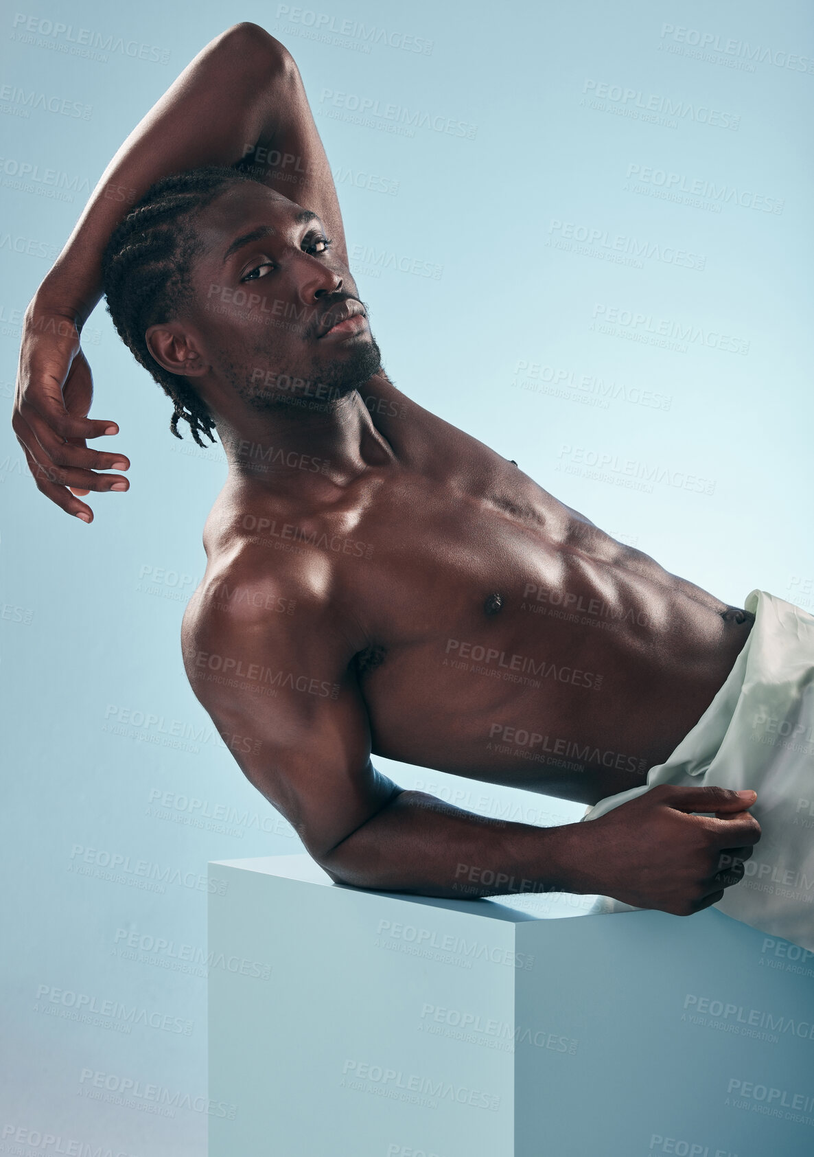 Buy stock photo Black man, beauty with grooming and fitness, shirtless in studio in portrait on blue background. Hygiene, skincare and African model with muscle, clean dermatology and natural cosmetics for wellness