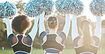 Back of cheerleader, sports and women on field for performance, dance and motivation for game. Teamwork, dancer and people in costume cheering for support in match, competition and event outdoors