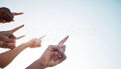 Buy stock photo Fingers, closeup and pointing to sky mockup, collaboration and direction for climate change. Group of diverse hands, wellness, teamwork and solidarity for message in marketing, advertising or vision