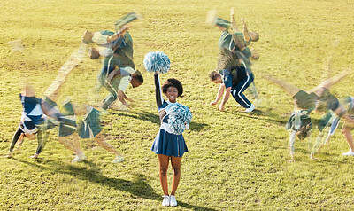 Cheerleader blur, sports and women on grass for performance, dance and motivation for game. Teamwork, dancer and people in costume cheer for support in match, competition and field event outdoors