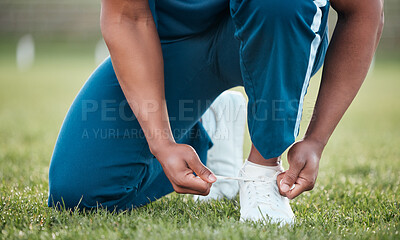 Buy stock photo Person, tie and shoes on grass in fitness or getting ready for sports workout, training or outdoor exercise. Closeup of athlete tying shoe on field in preparation for running or practice in nature