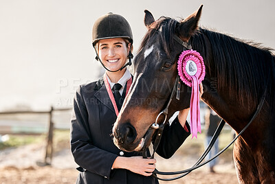 Buy stock photo Portrait, equestrian and a woman winner with an animal on a ranch for sports, training or a leisure hobby. Smile, award or prize ribbon and a happy young rider in uniform with her stallion outdoor