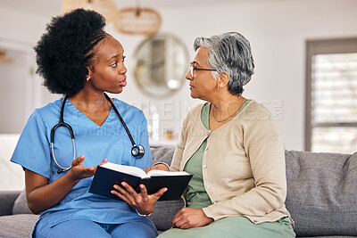 Buy stock photo Bible, religion and assisted living caregiver with an old woman in a retirement home together. Healthcare, christian faith or belief with a nurse or volunteer reading to a senior patient in a house