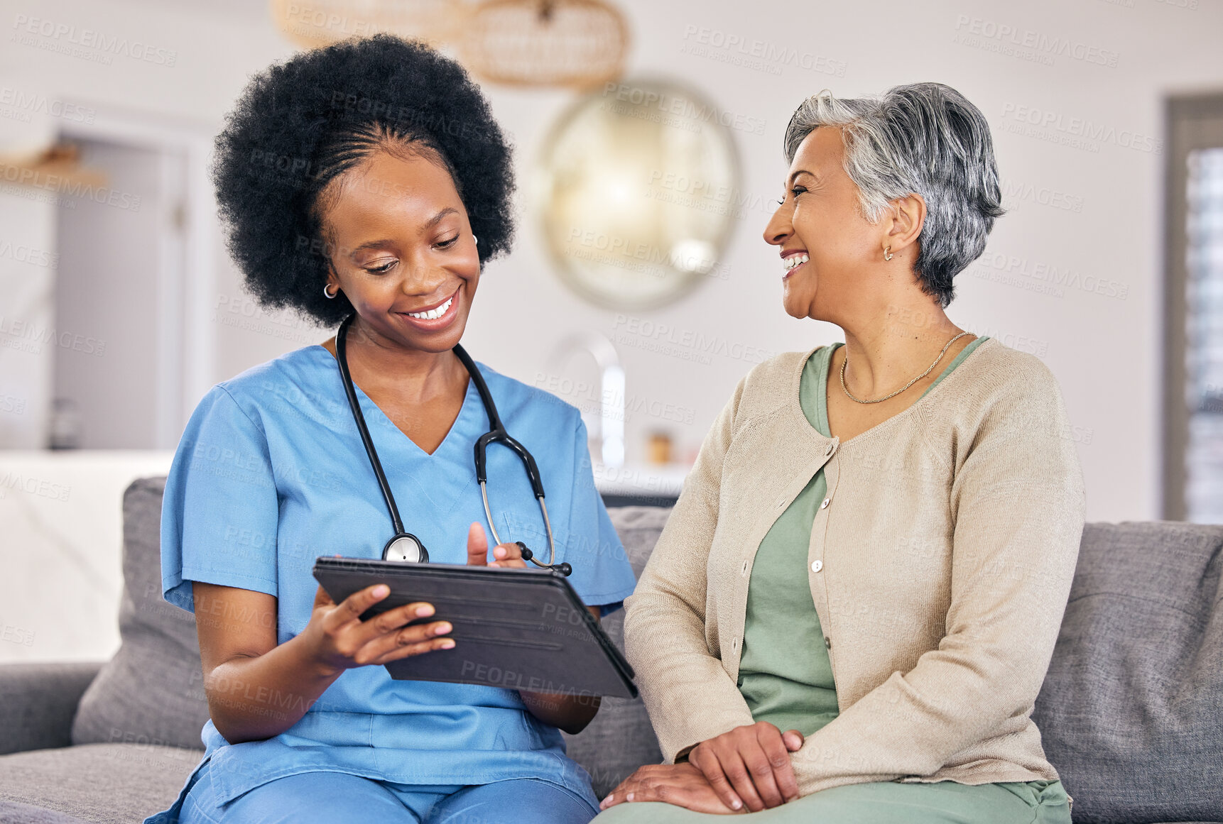 Buy stock photo Doctor, senior woman and tablet for consulting, results and happy for good news on sofa in nursing home. Elderly person, African nurse or medic with digital touchscreen for smile, analysis and report