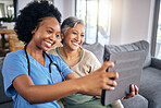 Selfie, tablet and assisted living caregiver with an old woman in the living room of a home together. Smile, support or community with a happy nurse or volunteer and senior patient in a house