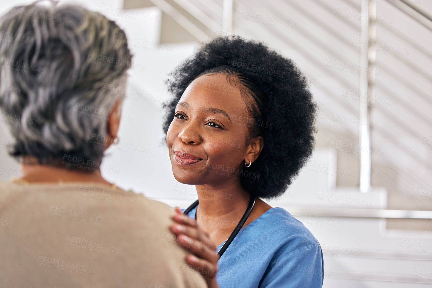 Buy stock photo Old woman, nurse and care with conversation, support and happiness with healthcare, smile and treatment. Comfort, African person and medical professional with senior patient, trust and caregiver