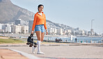 Woman, roller skates and park in city, portrait and outdoor for training, competition and fitness by ocean. Gen z girl, skating and walking for exercise, workout and metro road by sea in Cape Town