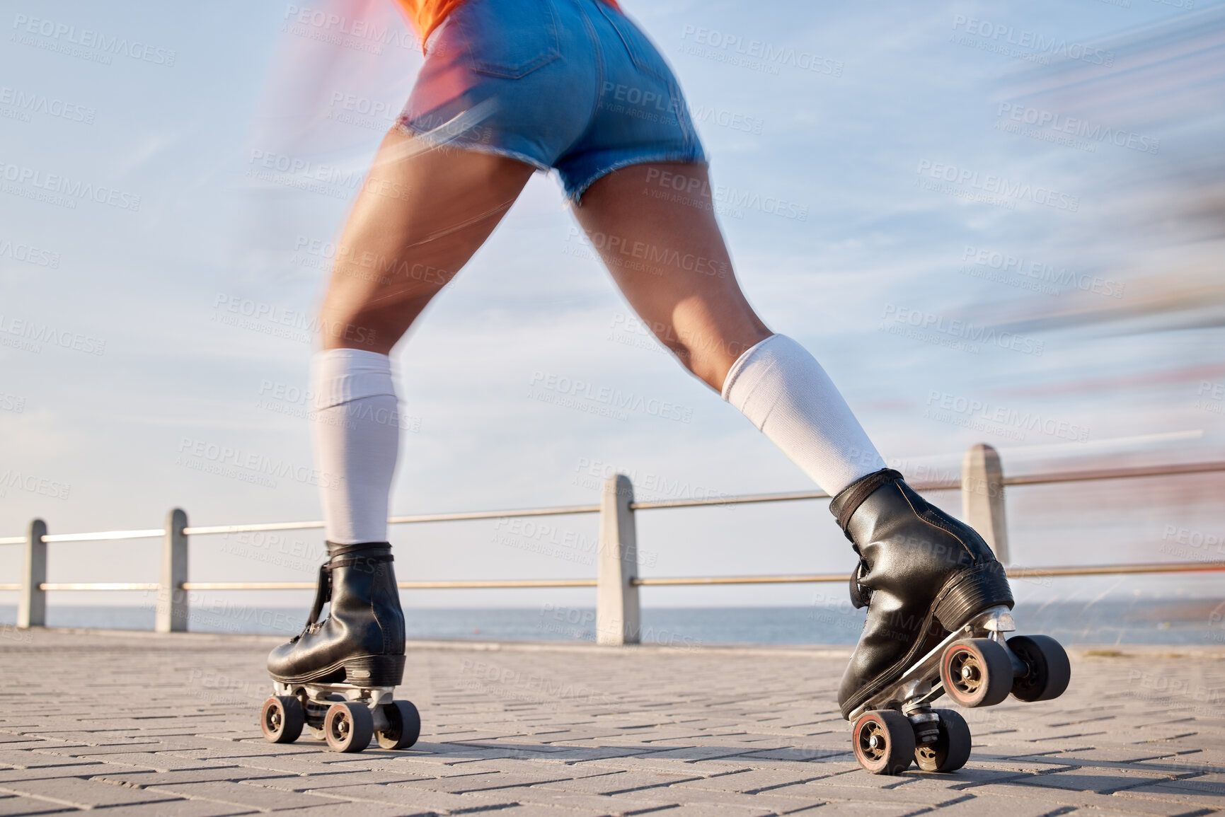 Buy stock photo Person, roller skate and fun for summer in closeup for wellness, training or activity for sport. Caucasian, model and fitness on boardwalk, beach and speed for balance, race or competition by alone