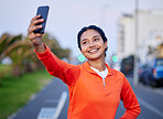 Selfie, woman and smile in street for profile picture, internet post and social media outdoor in nature with technology. City, girl and happiness in urban town for relax, freedom and cheerful online