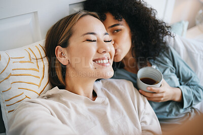 Buy stock photo Women, lesbian and kiss in bedroom with happiness, romantic and intimate for marriage with love. LGBTQ, diversity and bisexual couple with communication for support and smile at home with respect