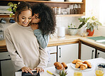 Lesbian, couple and kiss in kitchen with breakfast in morning together with nutrition, love and support in home. Lgbt, women or cooking with food, juice and preparing healthy diet on counter in house