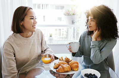 Buy stock photo Orange juice, coffee and happy lesbian couple in home at table bonding together. Drink, food and croissant of gay women in the morning for breakfast diet, eating and healthy interracial relationship