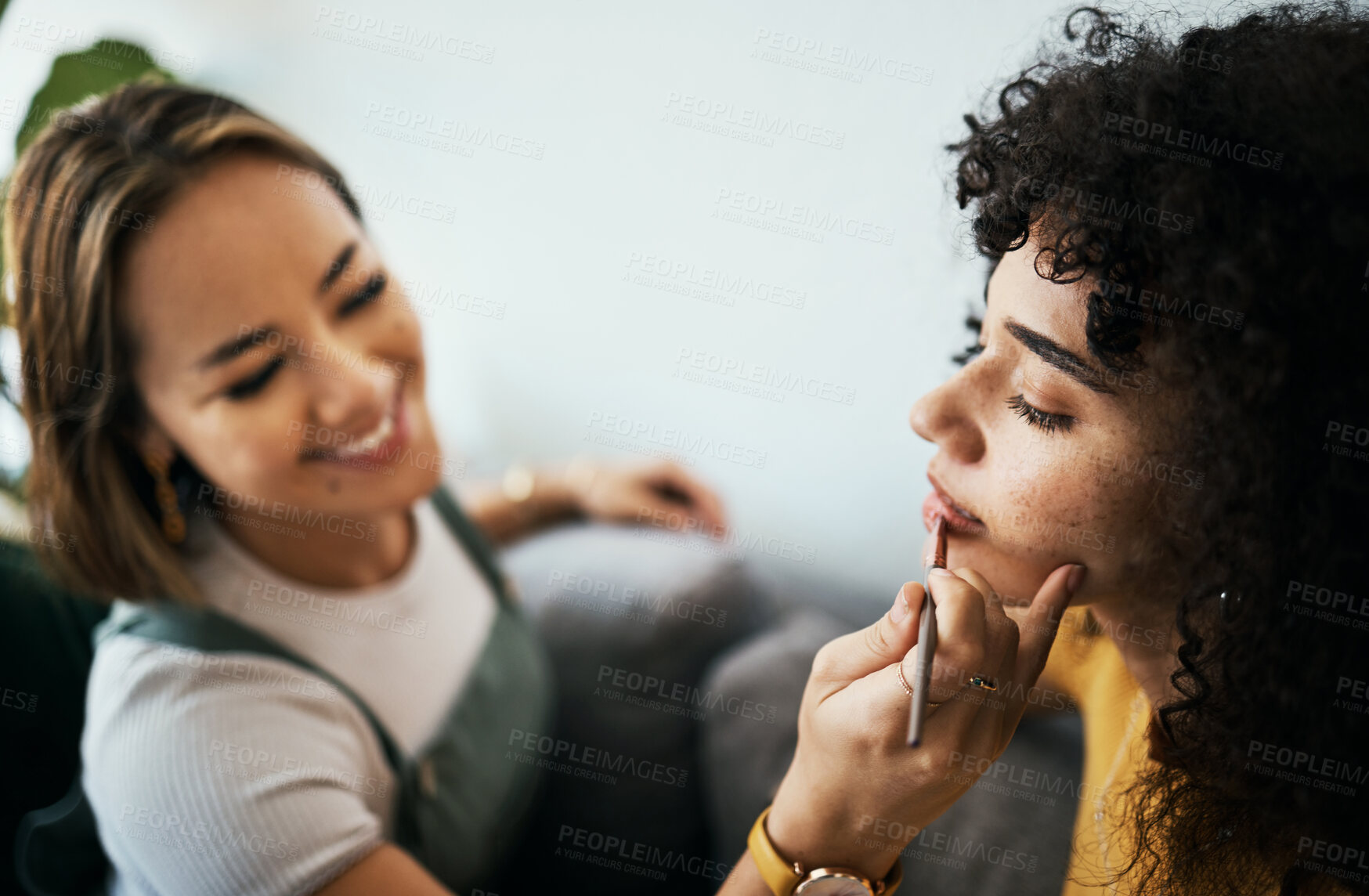 Buy stock photo Friends, woman and relax with makeup in home with closeup for cosmetics, beauty and wellness. Young, people helping and apply lipstick with hand by holding, product and peace in happy with precision