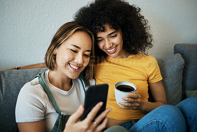 Buy stock photo Lgbtq, sofa and couple relax with phone and coffee for social media, internet and watching videos. Love, home and happy women in living room for bonding, relationship and streaming movies online