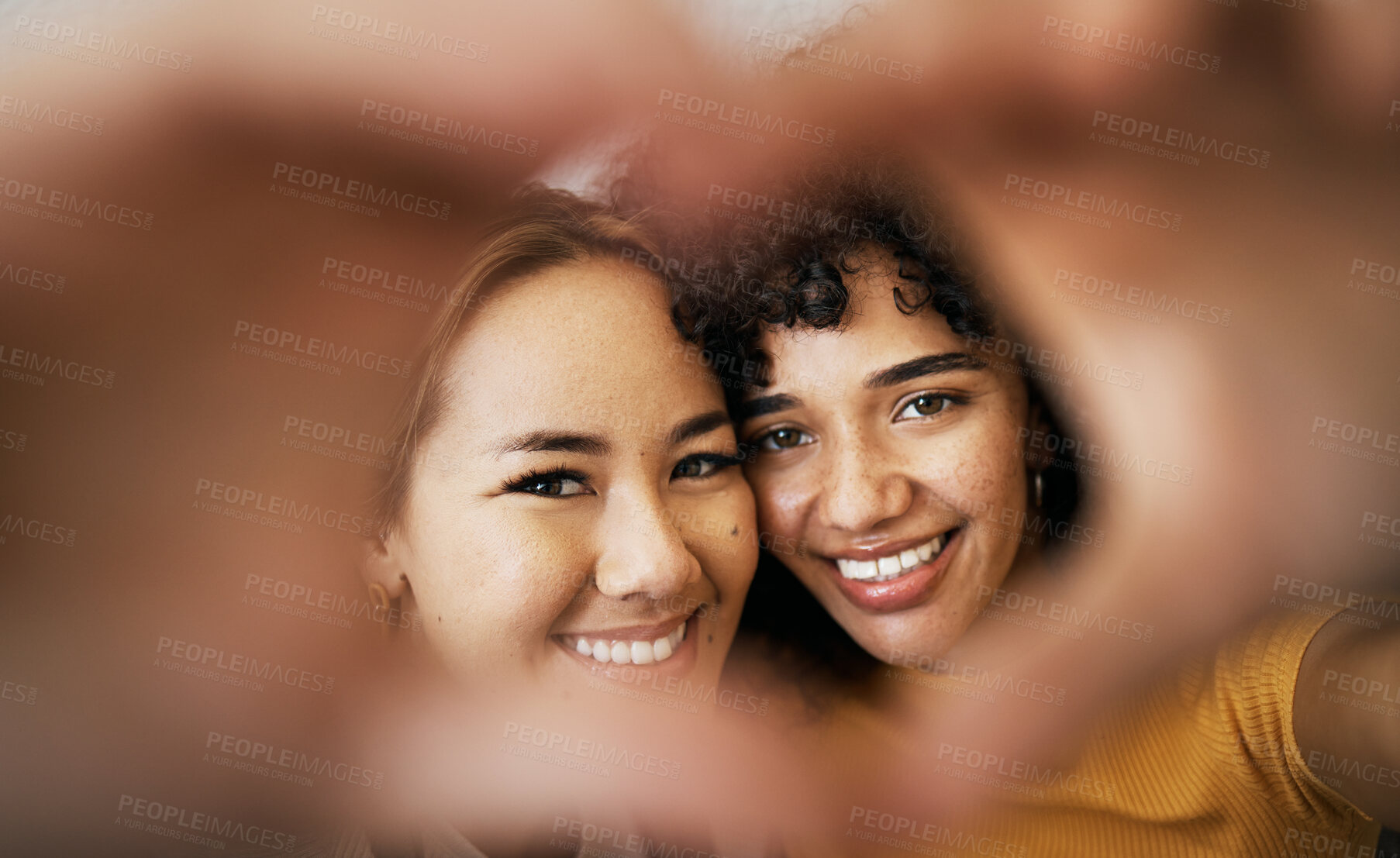 Buy stock photo Lesbian couple, smile and heart with hands, portrait and closeup for romance, bonding and love and support for relationship. Happy people, together and solidarity for pride, lgbtq and hope for peace