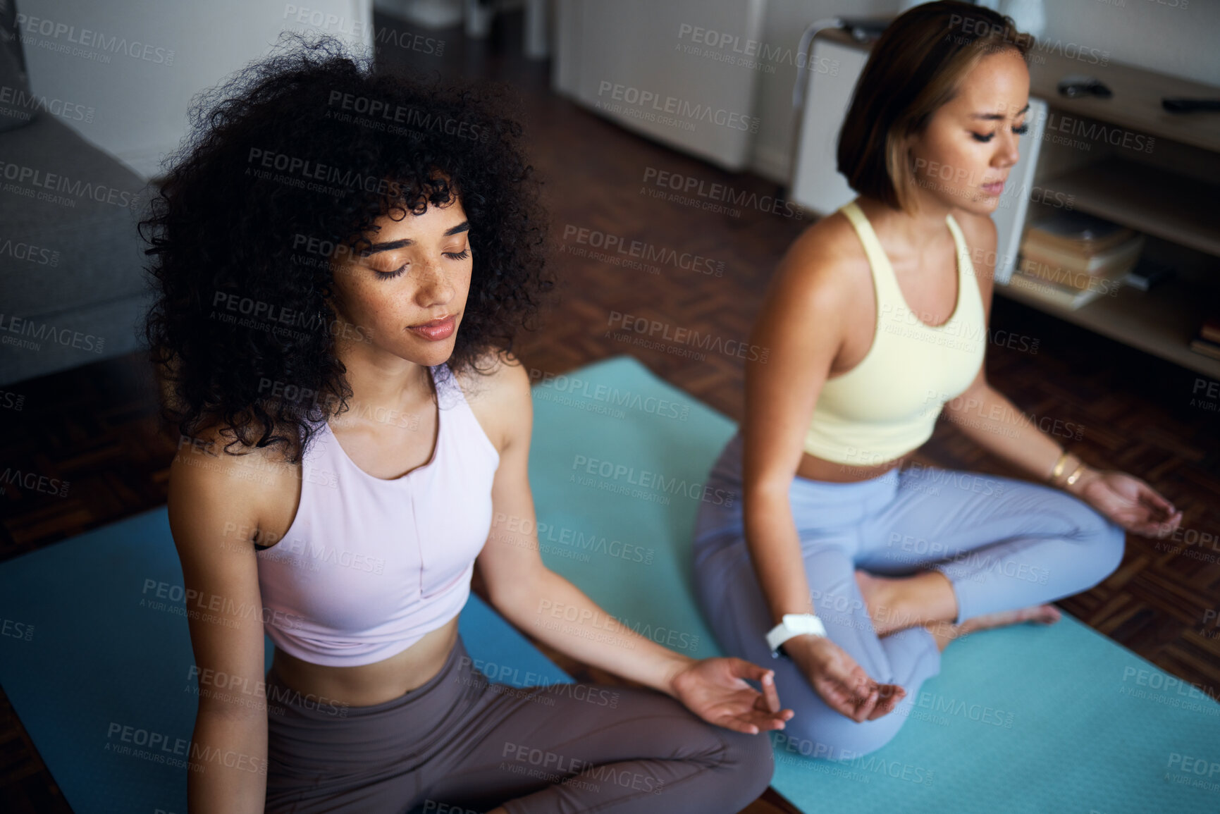 Buy stock photo Pilates, fitness and girl friends in the living room doing a meditation in lotus position together. Calm, peace and young women doing yoga workout or exercise for breathing in the lounge at apartment
