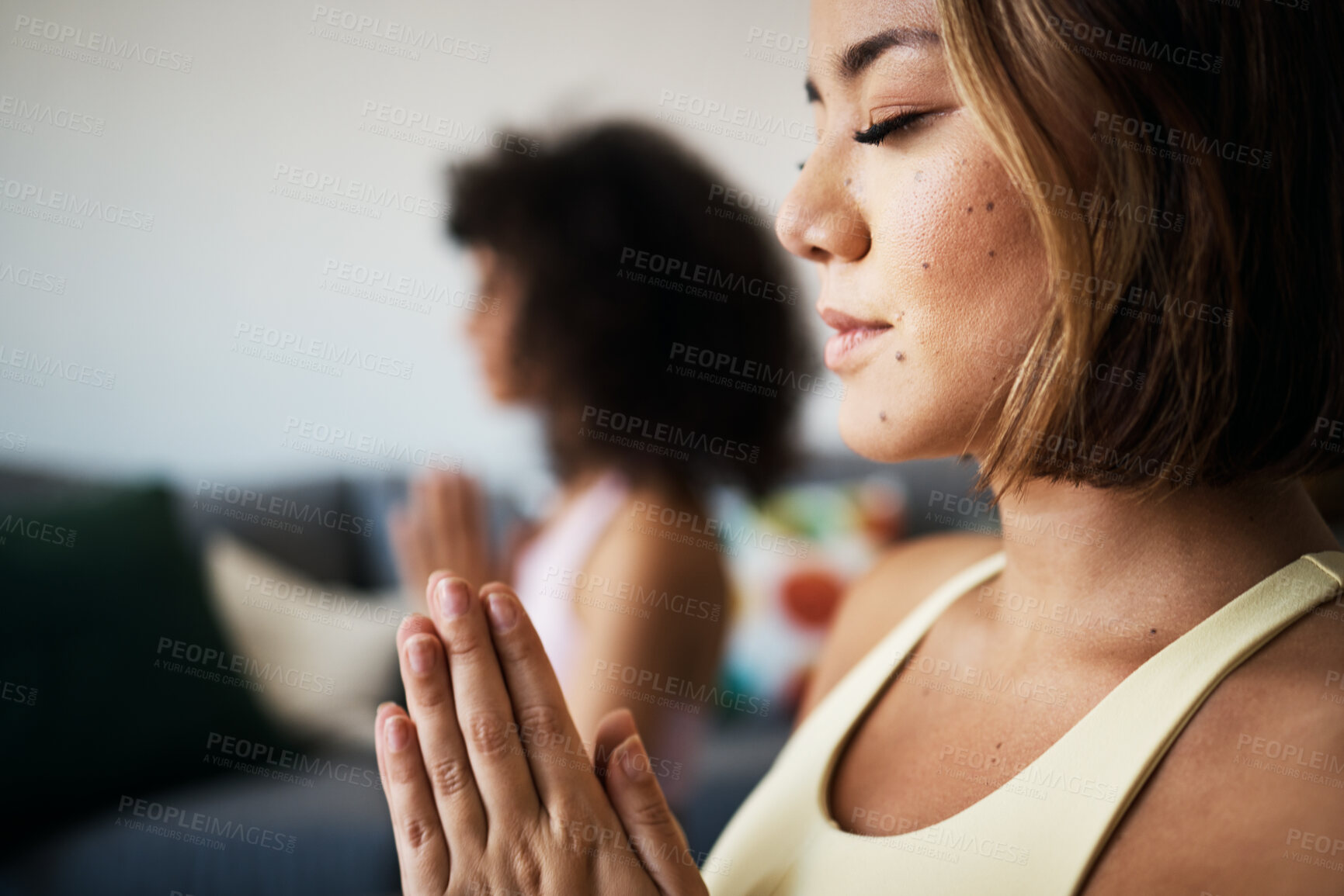 Buy stock photo Women, fitness friends and meditation with prayer for mindfulness, wellness and peace of mind at home. Yoga, spiritual and calm in lounge with healing and zen, namaste with exercise and self care