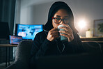 Hacker woman, coffee and night for coding, thinking and ideas for cybersecurity, data phishing and ransomware. Programmer, dark room and sofa to drink matcha for it scam, software or research on web