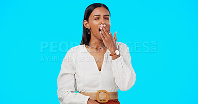 Buy stock photo Woman, yawn and hand on mouth, tired and studio by blue background, alone or isolated. Overworked person, burnout and low energy for deadlines, exhausted and fatigue or lazy for nap, sleep and rest