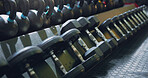 Dumbbell, weight and close up at gym for strong sport or wellness workout, training or goals. Exercise membership, workout and muscle power or build as athlete competition, performance or motivation