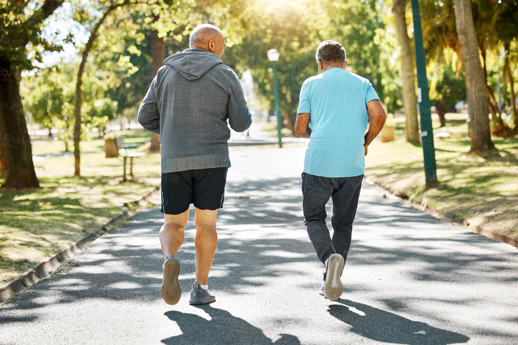 Buy stock photo Friends, walking and senior men in park for wellness, health and wellbeing for energy in retirement, Fitness, workout and back of mature people in nature for exercise, training and cardio together