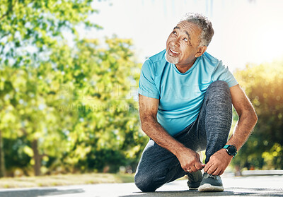 Buy stock photo Tying laces, man and in a park for running, exercise and getting ready for outdoor cardio. Smile, idea and a mature or senior male athlete with shoes in the street for a workout, exercise or training