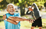 Senior man, portrait and stretching in fitness for workout, training or outdoor exercise in nature. Happy mature male person in body warm up or arm stretch for preparation, health or wellness at park