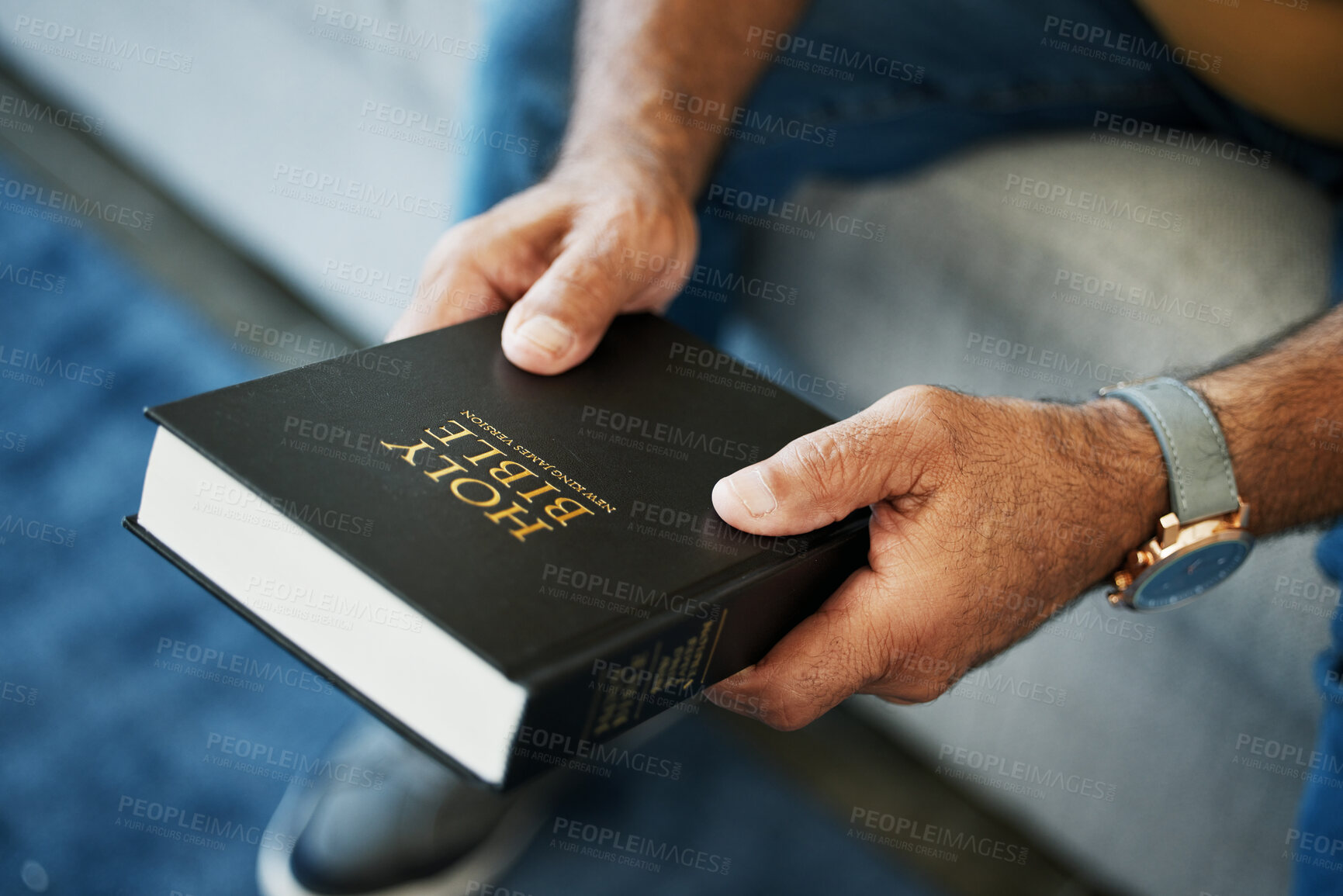 Buy stock photo Bible, book and hands of man in home with study of Christian faith, religion or spirituality knowledge. Holy, worship and person with gospel, scripture or learning about God or story of Jesus Christ