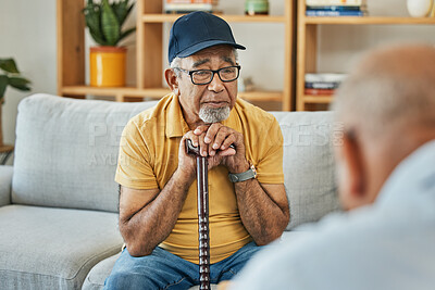 Buy stock photo Doctor, consultation and senior man on sofa with walking stick or counselling discussion in therapy with psychologist. Elderly patent, talking and therapist listening on couch in mental health office