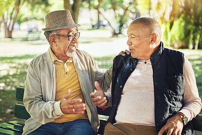 Buy stock photo Talking, senior and friends in a park for bonding, communication or together in retirement. Happy, elderly and men speaking with care, smile and enjoying conversation in nature interaction to relax