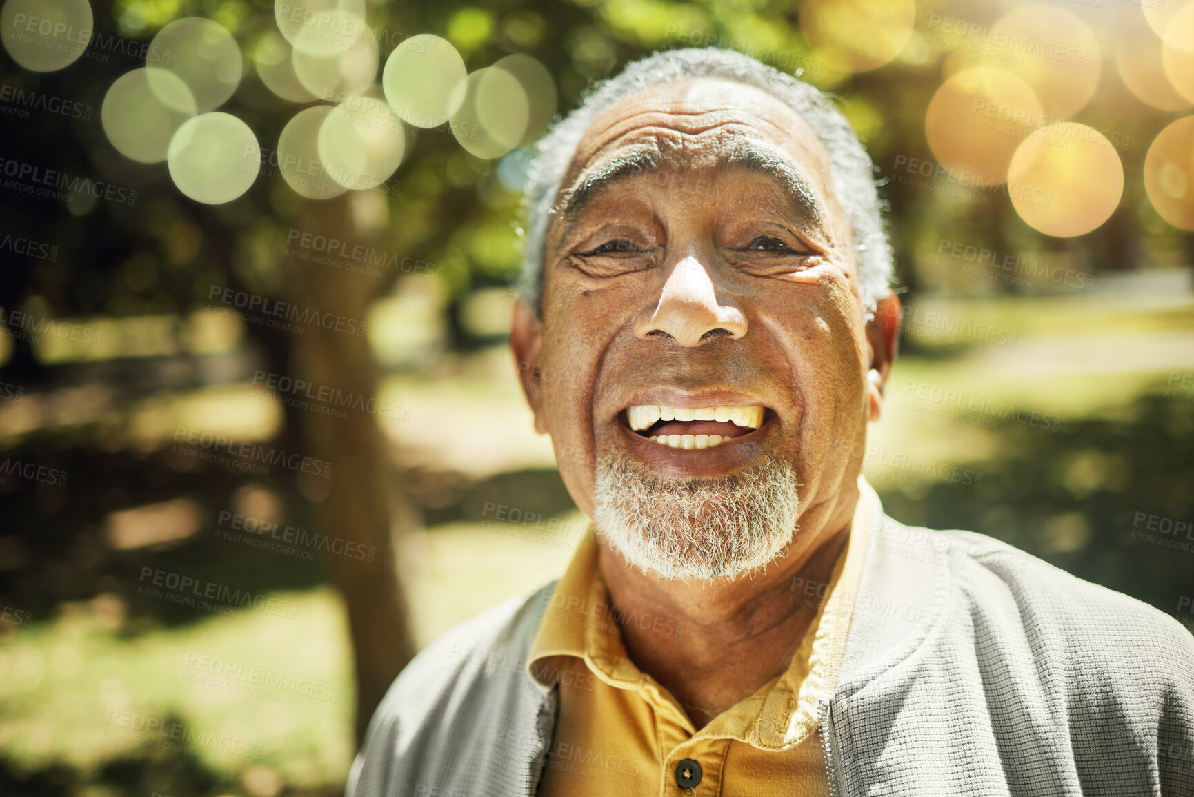 Buy stock photo Senior man, portrait and bokeh in nature, garden or park with freedom, confidence and wellness in retirement. Happy, face and elderly smile with pride in backyard, environment or holiday in summer