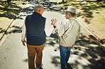 Senior, friends walking and talking in park, nature and outdoor in retirement with support and communication. Elderly, men and above people on sidewalk in Chicago with conversation and community